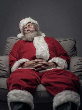 Santa Claus napping on the armchair