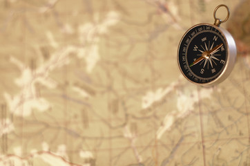 Fototapeta na wymiar compass at the map