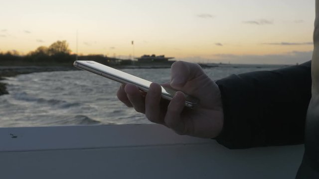 Hand typing sms mms on a smartphone