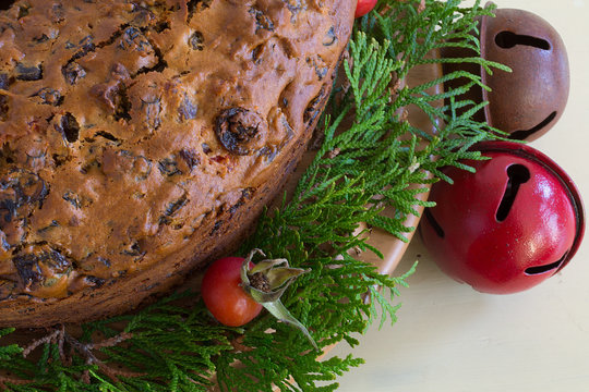 Traditional homemade fruitcake decorated with natural materials.