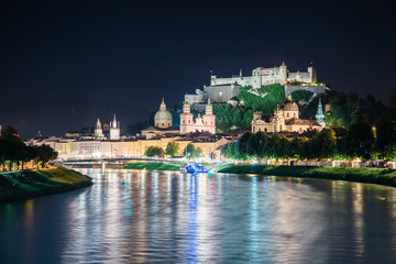 Fototapeta na wymiar Great view on an evening city shining in the lights. Picturesque scene. Location famous place (unesco heritage) Festung Hohensalzburg, Salzburger Land, Austria, Europe. Beauty world