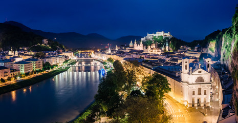 Fototapeta na wymiar Great view from the top on an evening city shining in the lights. Location famous place (unesco heritage) Festung Hohensalzburg, Salzburger Land, Austria Europe. Beauty world.