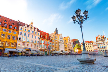 Naklejka premium Fantastic view of the ancient homes on a sunny day. Location famous Market Square in Wroclaw, Poland, Europe. Historical capital of Silesia. Beauty world.