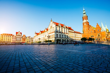 Fototapeta premium Fantastic view of the ancient homes on a sunny day. Location famous Market Square in Wroclaw, Poland, Europe. Historical capital of Silesia. Beauty world.