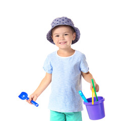 Cute little boy with beach toys on white background