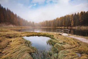 Foto op Canvas Great view of the foggy lake Antorno in National Park Tre Cime di Lavaredo. © Leonid Tit