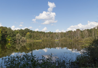 German lake landscape with blue sky and water reflections