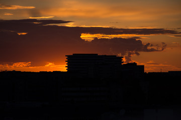 Fototapeta premium Building silhouette under dramatic sunset
