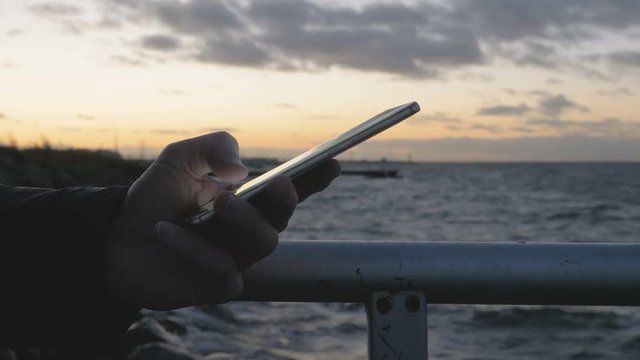 Hand typing sms mms on a smartphone