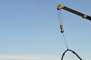 crane lifts a pipe