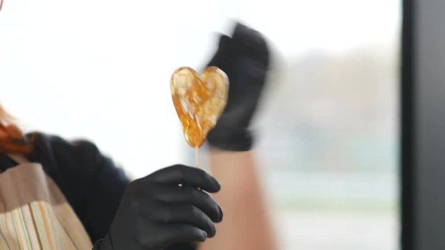 preparing candy on a stick
