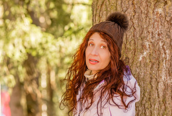 smiling woman in woods
