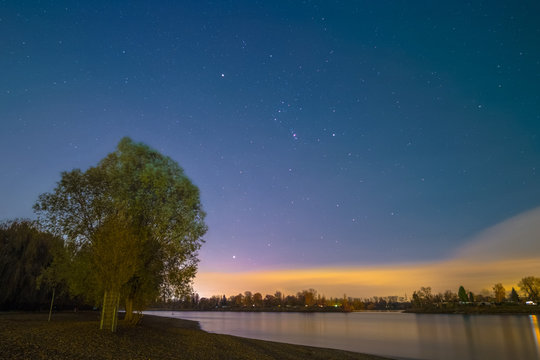 The Orion Constellation as seen from the shore of the river Rhine at Mannheim in Germany.