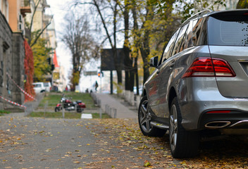 Crossover parked on autumn street