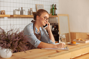 Positive smart woman being at work