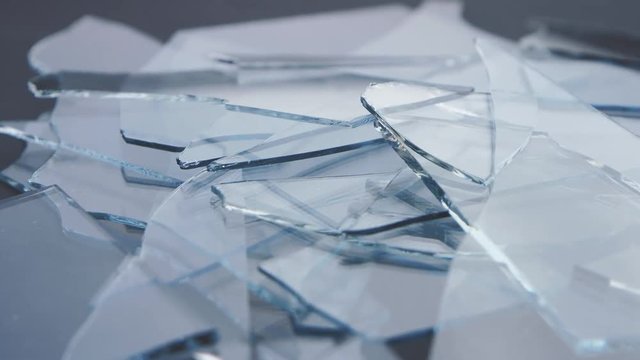 Transparent shards of broken glass. Close up