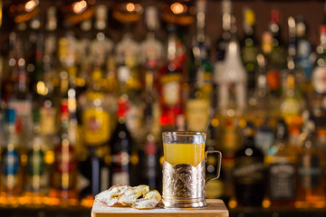 Hot apple cider served with dried apple and cookie