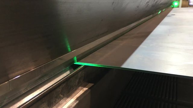 Precision laser assisted steel bending machine that clamps large sheets into customized customer specifications.