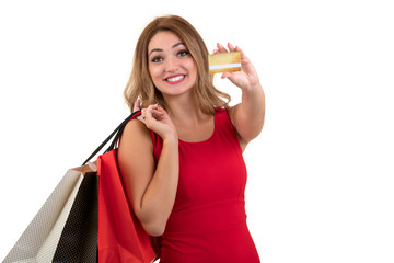 Cheerful excited surprised young woman with credit card over white background