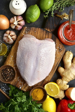 Raw organic chicken breast with ingredients for making.Top view with copy space.
