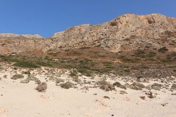 Rough Balos Lagoon (or Balos Beach) trail landscape in northwestern part of Crete Island, Greece. After 10 kms of bumpy car road, about 7 kms of footpath leads to the famous beach.