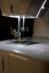 Sewing machine for manufacturing background.