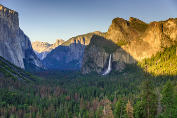 View of Yosemite Valley from Tunnel View point at sunset - view to Bridal veil falls, El Capitan and Half Dome - Yosemite National Park in California, USA