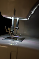 Sewing machine for manufacturing background.