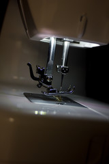 Sewing machine for manufacturing background.