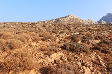 Rough Balos Lagoon (or Balos Beach) trail landscape in northwestern part of Crete Island, Greece. After 10 kms of bumpy car road, about 7 kms of footpath leads to the famous beach.