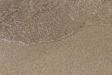 Fototapeta na wymiar Crystal clear water and fine sand at Falassarna beach in western Crete island in Greece.
