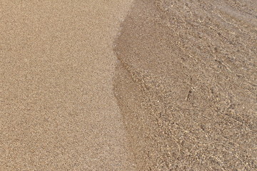 Fototapeta na wymiar Crystal clear water and fine sand at Falassarna beach in western Crete island in Greece.