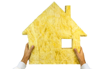 Glass wool with shape of house  in the craftsmans hands on white background