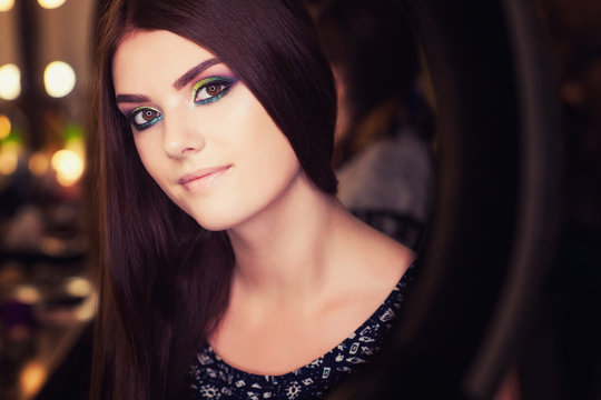 beautiful evening make-up young brunette with a smile