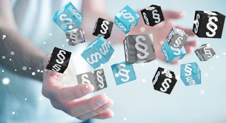 Businessman holding and touching 3D rendering law cubes