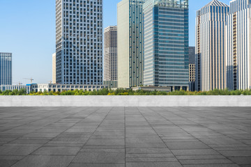 Panoramic skyline and buildings with empty square floor.