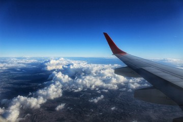 Obraz premium Clouds and landscape from an airplane