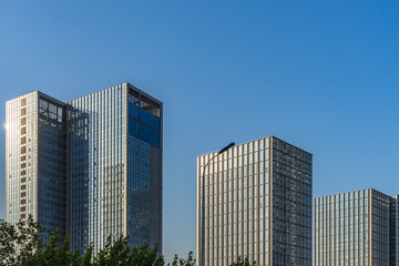 Obraz premium Modern office building against blue sky.