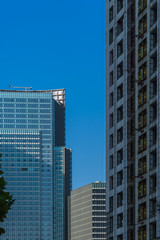 Fototapeta premium Modern office building against blue sky.