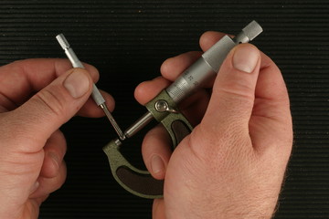 Metric Micrometer, Small hole gauge, black toolbox mat background