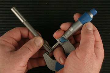 Imperial Vernier Micrometer,  measuring chucking reamer, black toolbox mat background