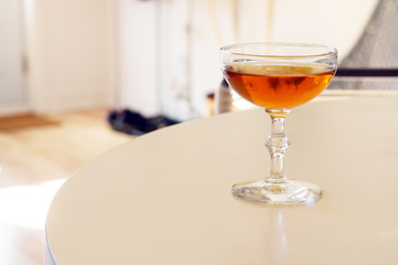 Alcoholic drink in a vintage retro coupe glass