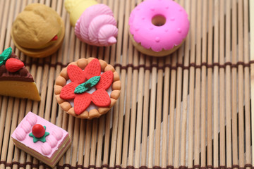 Miniature people :  Male and female traveler miniature figures with dessert , donut