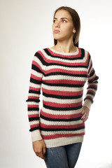 woman in a striped sweater on a white background