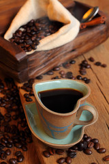Hot black coffee and bean coffee.