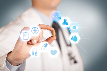 Obraz premium A doctor in white holding a pill