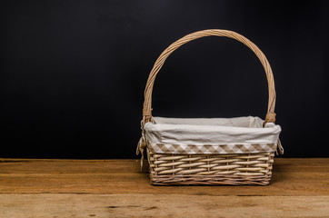 wicker basket on wooden table - 180410374