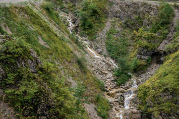 Fototapeta na wymiar Stream at Alp mountains at summer. Tirol Austria