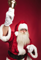 santa claus ringing bell and pointing finger