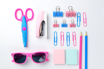 Stationary concept, Flat Lay top view Photo of school supplies scissors, pencils, paper clips,calculator,sticky note,stapler and notepad in pastel tone on white background with copy space, flat lay 